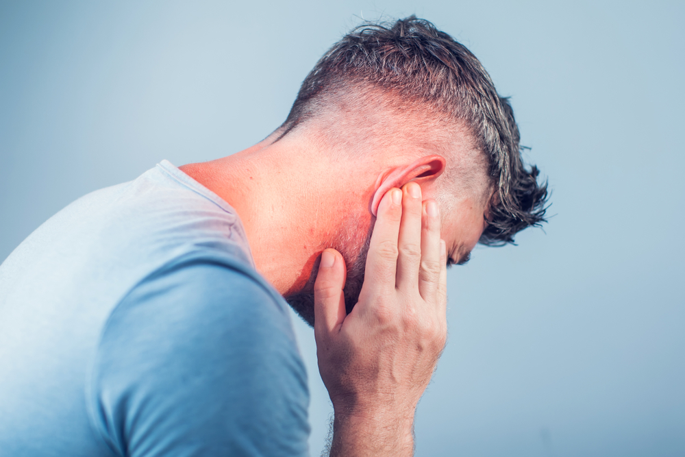 male having ear pain