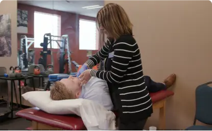 girl doing jaw massage on man