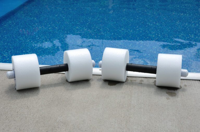 Pair of Water Aerobics Dumbbells by the Side of a Swimming Pool